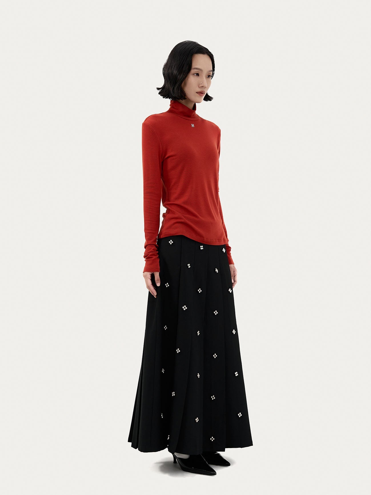 PLEATED SKIRT WITH BEADED EMBELLISHMENTS